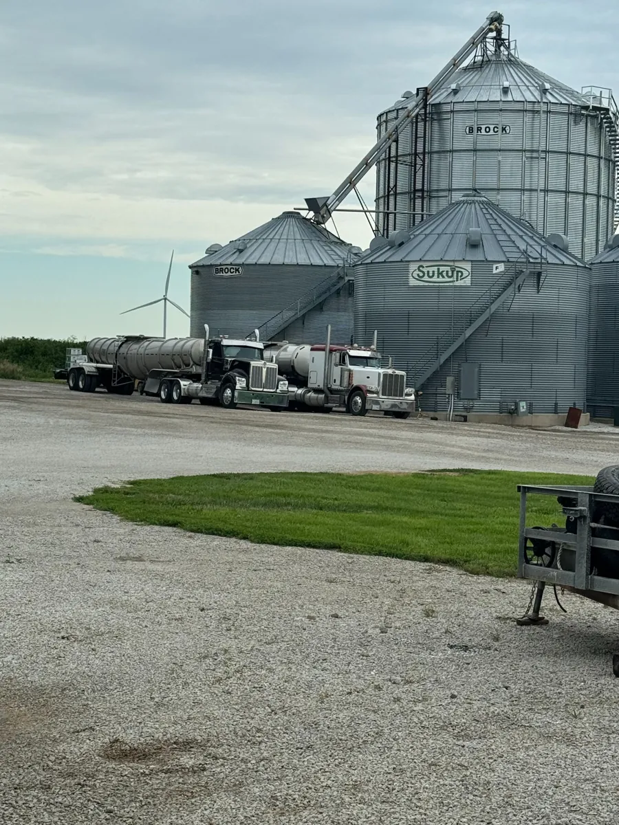 Grain bins and trucks at the farm